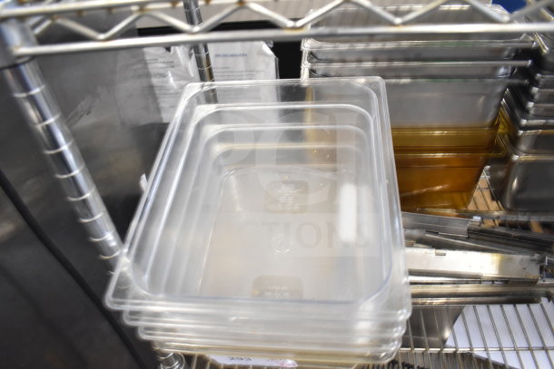 Two-tier shelf with various items, including clear and brown drop-in bins, in good condition.