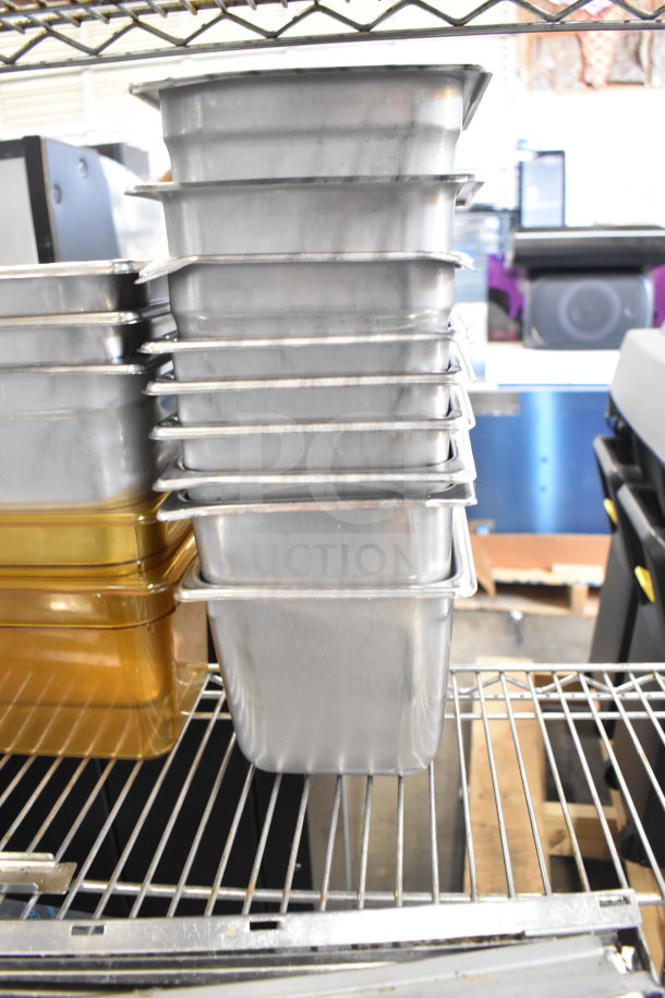 Two-tier lot with stacked metal and amber drop-in bins on metal shelving, showing light wear, ideal for storage or organization.