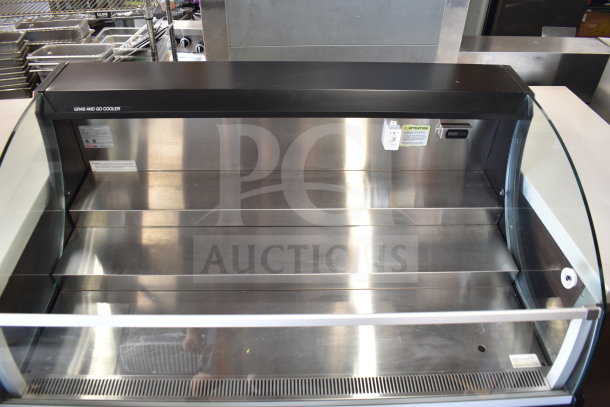 Turbo Air TOM-50SB-N 50" black horizontal air curtain display case, stainless interior, tags visible, excellent condition.