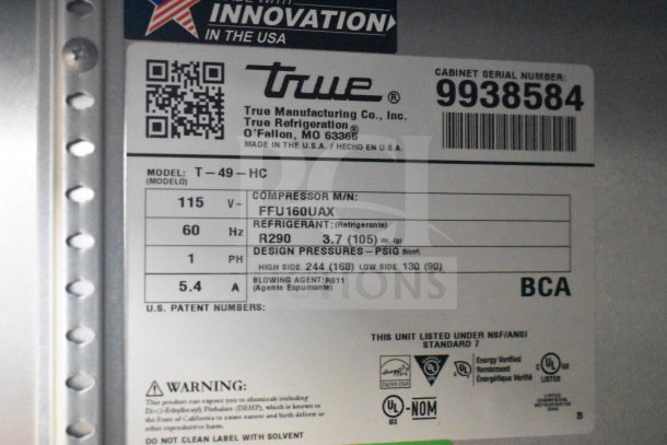 2020 True T-49-HC commercial cooler label showing model, voltage, refrigerant, and serial number. 115 volts, 1 phase.