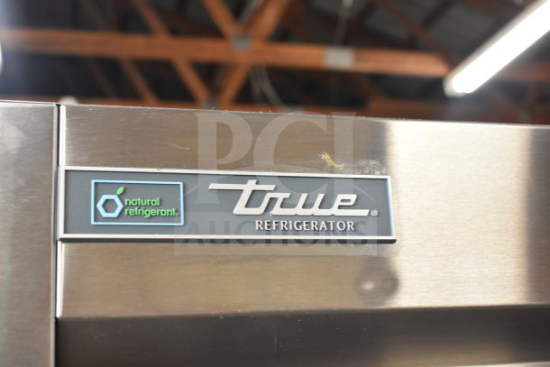2020 True T-49-HC Commercial 2 Door Cooler; features True branding and "natural refrigerant" label; in good condition.