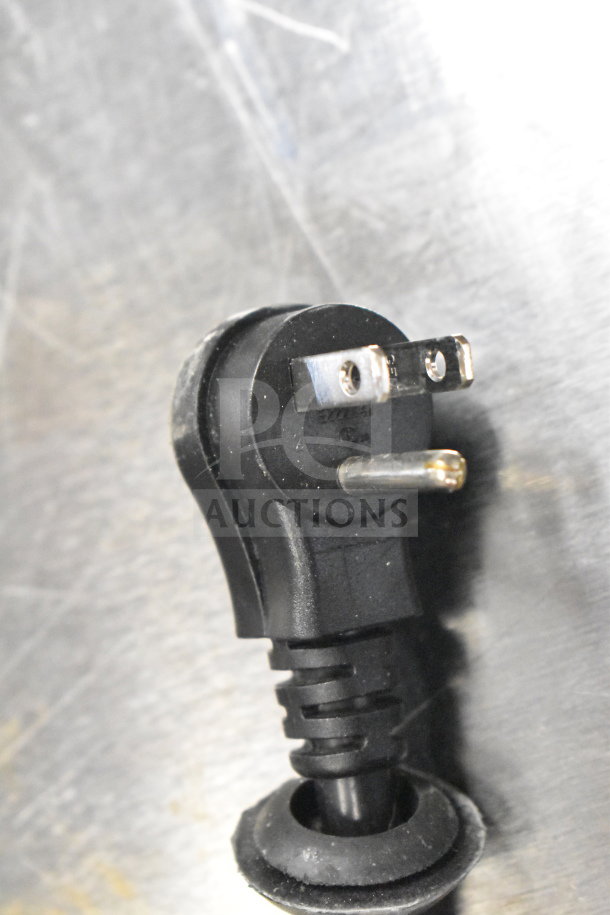 Close-up of 2025 Avantco 178Z2FHC freezer power plug, 115V, 1 phase, stainless steel surface visible.