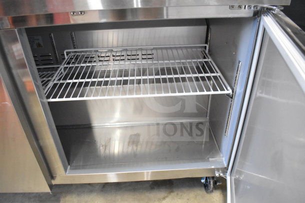 Avantco 178SSPT6010 Commercial Sandwich Salad Prep Table, new with minor scratches, open door showing interior wire shelf.
