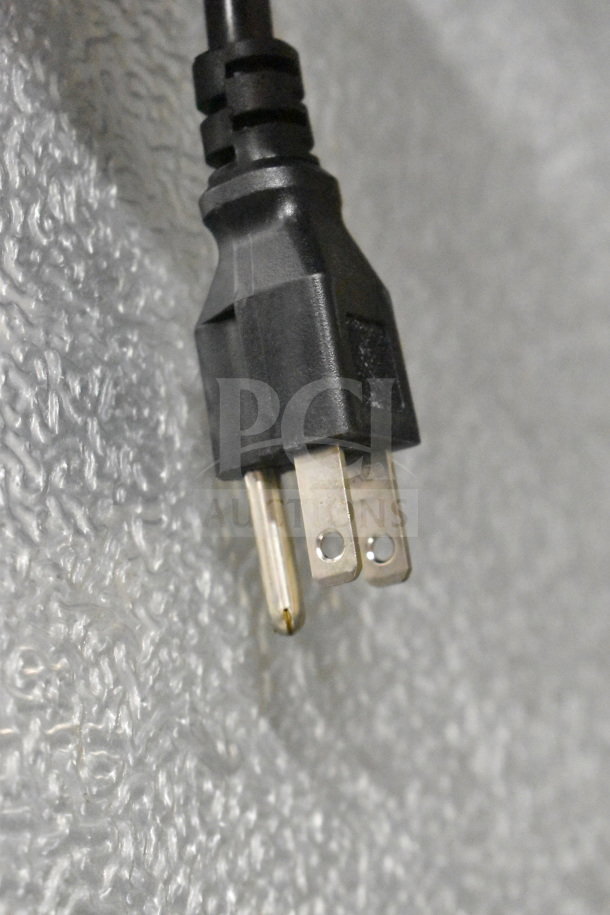 Alt text: Close-up of a power plug for the Avantco 178SSPT6010 sandwich prep table, showing standard prongs.