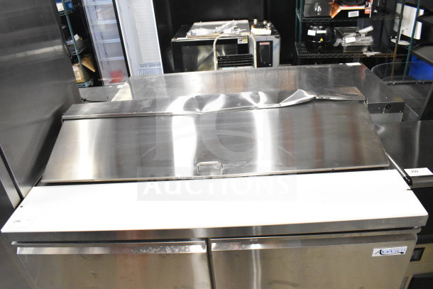 Brand new Avantco 178SSPT6010 commercial prep table, 115V, with visible dent on lid. Mega top design, model label visible.