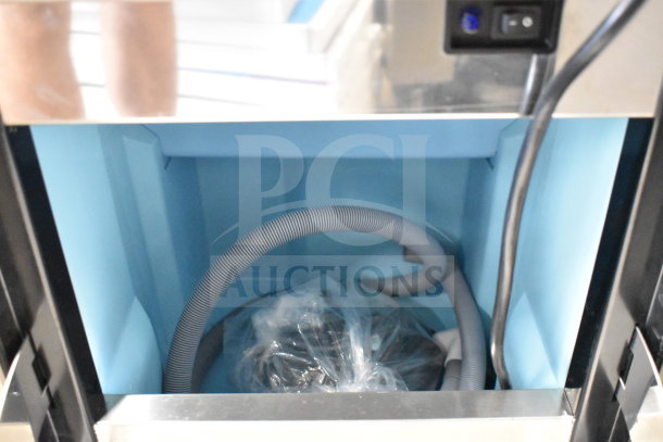 Avantco 194EUCG80A ice machine interior showing new hoses and fittings. Trim exterior visible. Brand new, 33 lb. bin capacity.
