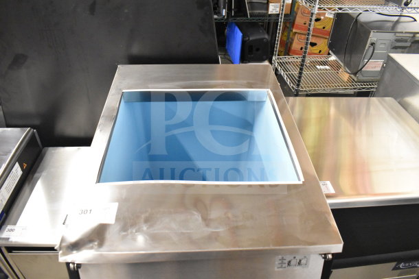 Brand new Avantco 194EBIN40022 ice storage bin, 22" stainless steel, 400 lb capacity, visible dent, blue interior.