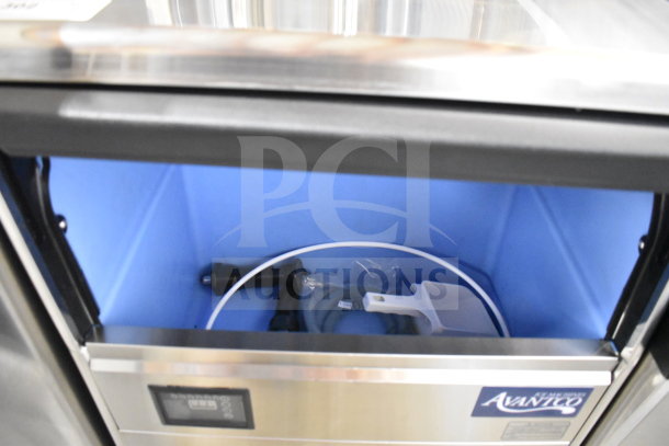 Brand new Avantco 194UN300A undercounter ice machine, 115V, 1 phase, full cube, minor scratches, label visible, interior view.