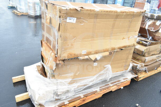 Cardboard boxes on a pallet, wrapped in plastic, labeled "D103". Boxes show wear and partial tearing. Contains work table, cutting board, pan rack.