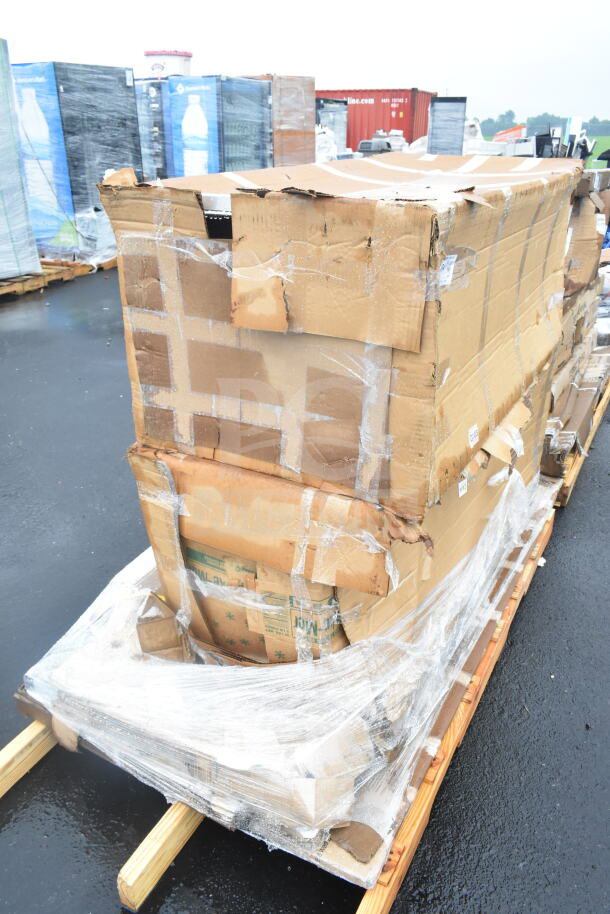 Damaged boxes containing new scratch and dent items, including a work table, cutting board, and pan rack, wrapped on a pallet.