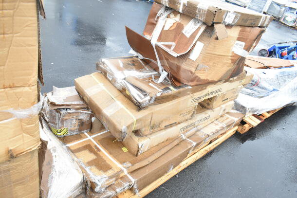 10 brand new scratch and dent items in boxes, including work table, pan rack, shelves. Visible item labels and packaging wear.
