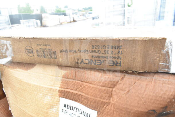 Cardboard box labeled "REGENCY Space Solutions" with an 18" x 36" green epoxy wire shelf inside. Box marked "scratch and dent."