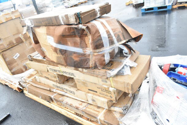 10 brand new scratch and dent items, including a work table, pan rack, and shelves, on pallets. Packaging slightly damaged.