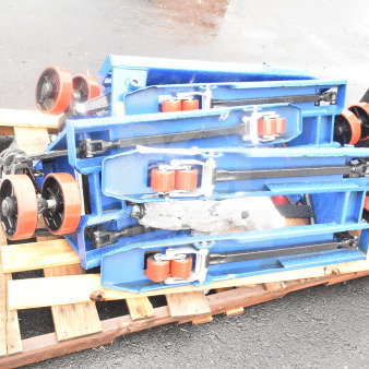 3 brand new Lavex 481XN25DF400 manual pallet jacks, 17" x 35 1/2", 4,400 lb capacity, stacked on a wooden pallet.