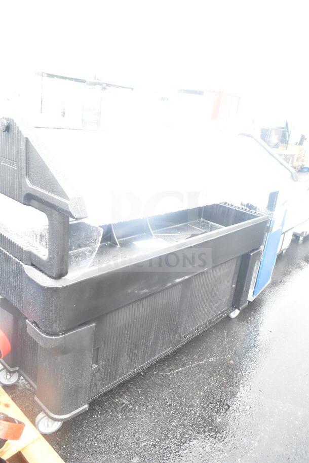 BRAND NEW SCRATCH AND DENT! Black portable buffet station with wheels, slight surface imperfections visible, ideal for events.