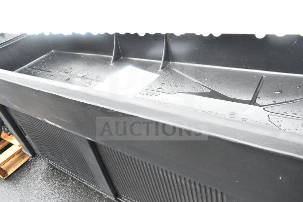 Brand new black portable buffet station with light scratches and dents, spacious storage, sleek design.