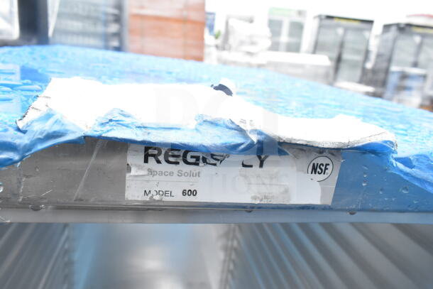 Regency 600AEC1820 bun pan rack, half height, enclosed, 20-pan capacity. Brand new, scratch and dent. NSF label visible.