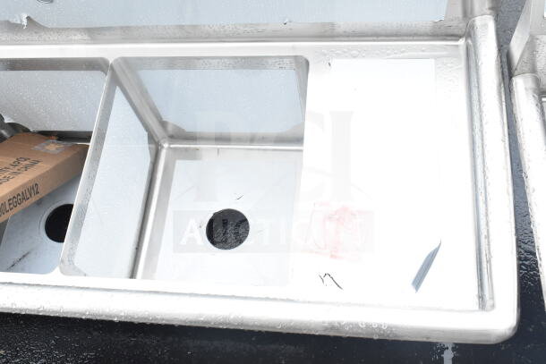 Brand new Steelton 522CS31416LR 66" three-compartment sink, two 12" drainboards, 14"x16"x12" bowls, scratch and dent.