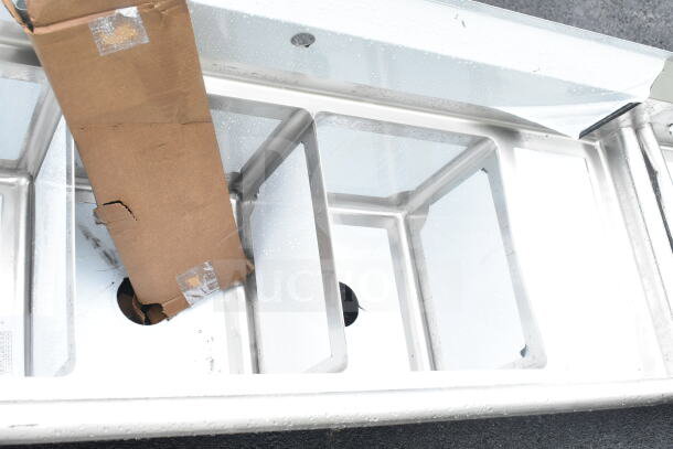 Steelton 522CS31416LR sink, three compartments, two 12" drainboards, 14"x16"x12" bowls, scratch and dent, new condition.