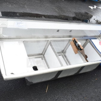 Brand new Steelton 522CS31416LR 66" three compartment sink with two 12" drainboards, 14" x 16" x 12" bowls, slight scratches.