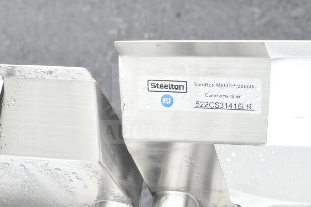 "Steelton 522CS31416LR sink label close-up, showing brand and model details on stainless steel surface."