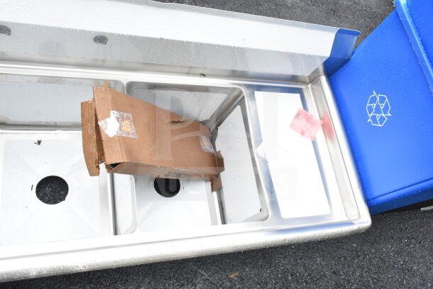 Brand new Steelton 522CS31416LR 66" three-compartment sink with two 12" drainboards, minor scratches, 14"x16"x12" bowls.