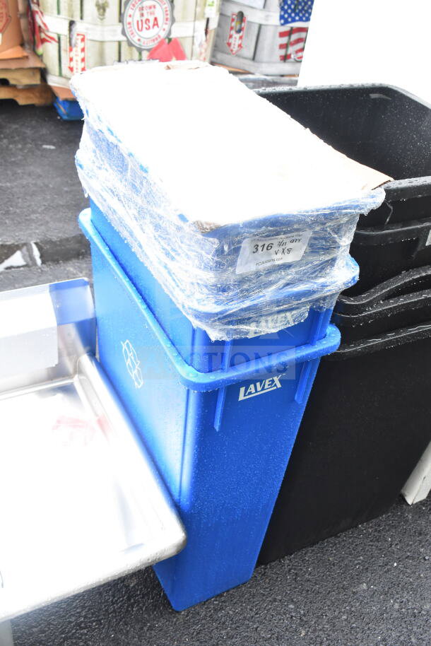 Blue Lavex Slim Jim trash cans, new, wrapped in plastic, with visible "Lavex" branding. Scratch and dent condition.