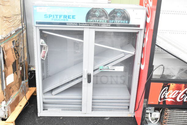 Gray metal two-door display cabinet merchandiser, featuring adjustable shelves, Copenhagen branding, and lockable doors.