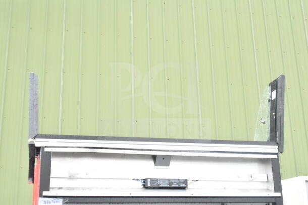 True TAC-48 commercial reach-in merchandiser, 208-230V, 1-phase, partial view with front panel open, some visible wear.