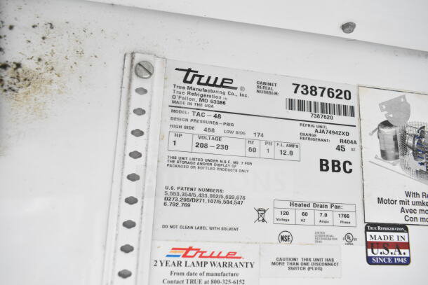 True TAC-48 Commercial Reach In Merchandiser label, model TAC-48, 208-230V, 1 Phase, serial 7387620, R404A refrigerant.