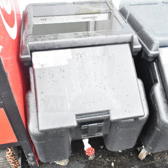 Cambro black poly portable ice bin on commercial casters, brand new with scratch and dent, visible handle and drainage spout.