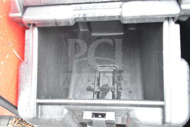 Brand new Cambro black poly portable ice bin, featuring commercial casters. Minor scratches visible, indicating "scratch and dent" condition.