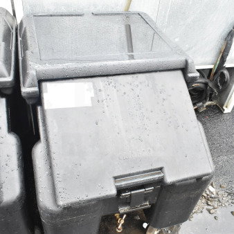 Cambro black poly portable ice bin with commercial casters, new with minor scratches.