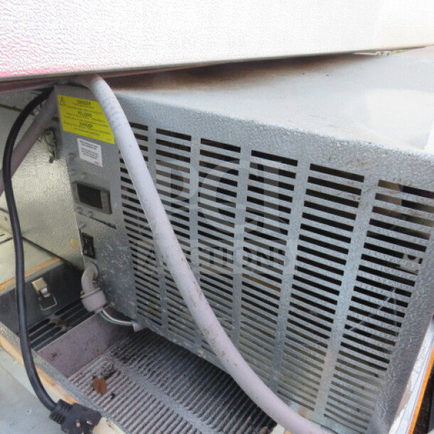 One Norlake 4x6 self-contained walk-in cooler with floor, visible control panel and wiring, used, functional upon removal.