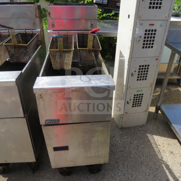 Pitco SG14 natural gas deep fryer with 2 baskets, on casters. Dimensions: 15.5x34x45.5 inches.