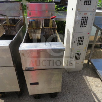 Pitco SG14 natural gas deep fryer with 2 baskets, on casters. Dimensions: 15.5x34x45.5 inches.