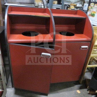 Dual trash receptacle with cans on casters, red finish, dimensions 42.5"x20"x45.5", used, two compartments, metal handles.