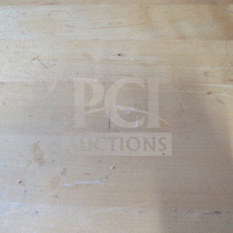 Solid wooden table top on pedestal base, 24x24x30 inches. Features visible scratches, highlighting used condition.