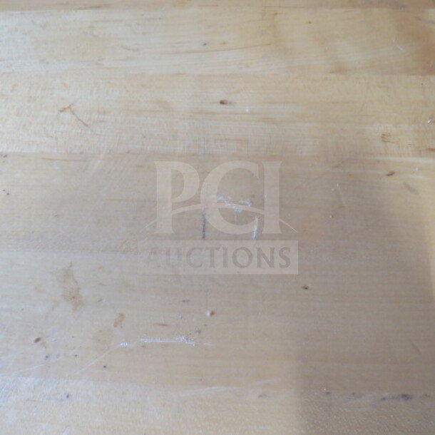 Solid wooden table top on a pedestal base, 24x24x30 inches. Visible scratches and wear.