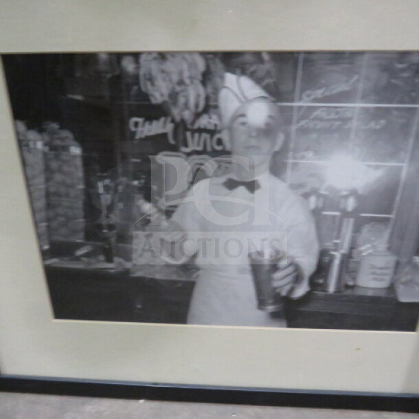 17x21.5 framed vintage-style black and white photo of a server in a diner setting, excellent condition.