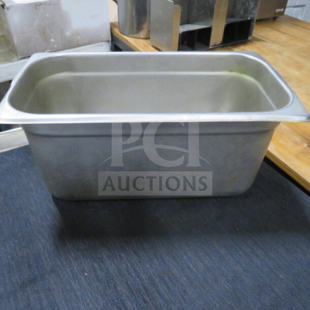 Stainless steel 1/4 size hotel pan, 6-inch deep, used condition, ideal for commercial kitchens.