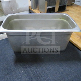 Stainless steel 1/3 size, 6-inch deep hotel pan in good condition. Ideal for kitchens, catering, or buffets.