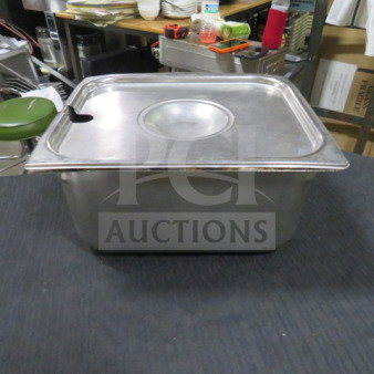 Stainless steel 1/2 size 6-inch deep hotel pan with lid, featuring a slot for utensils, in good condition.