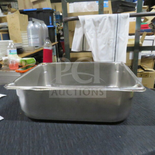 1/2 Size 6 Inch Deep Hotel Pan, stainless steel, used condition, ideal for catering or food service.