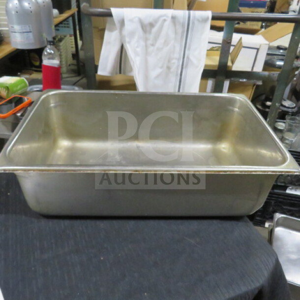 Full Size 6 Inch Deep Hotel Pan 3XBID, stainless steel, used condition, sturdy construction, ideal for commercial kitchens.