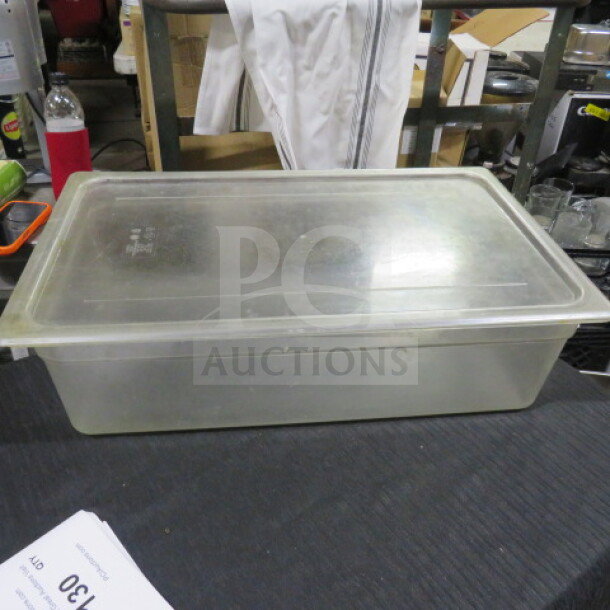 Full-size 6-inch deep food storage container with lid, transparent, used condition, visible label "2XBID".