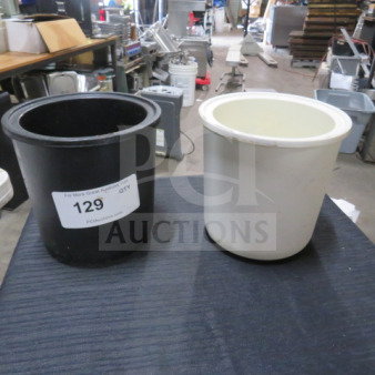 Two assorted refrigerated bowls, black and white, in good condition. Black bowl labeled with lot number 129.