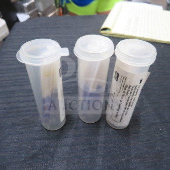 A lot of three test strip containers with secure lids, visible labels, and manufacturer details. Appears in good condition.
