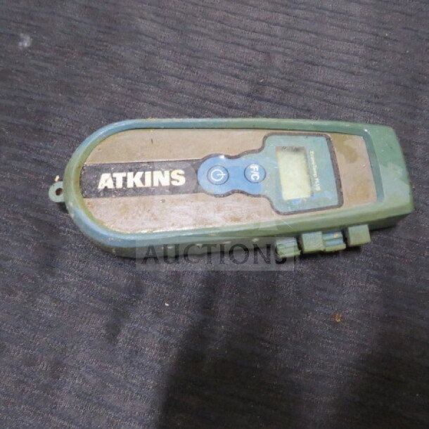 Atkins Econo Temp Plus thermometer, worn condition, with display screen and control buttons visible.