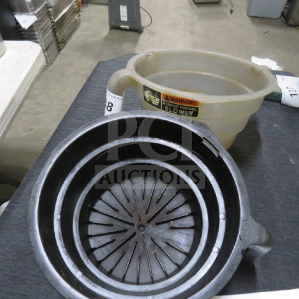 Filter Basket 2XBID, two-piece set. Includes a black inner basket and translucent outer container. Used condition.